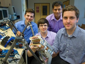 Four Western mechatronic systems engineers Jochem van Gaalen, Adam Newsome, Anish Naidu and Wesley Johnson have built an electro-mechanical arm designed to help stroke victims in London on Thursday. Mike Hensen/The London Free Press/QMI Agency