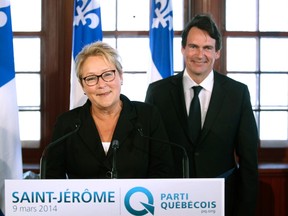 Parti Quebecois leader Pauline Marois smiles after introducing her new candidate for the sovereigntist party, Pierre Karl Peladeau, former president and CEO of Quebecor Inc., in Saint-Jerome, Que., this week. Quebec voters will go to the polls in a provincial election April 7. (Christinne Muschi/Reuters)