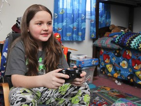 Dakota Spencer, 10, decided two years ago that he was going to grow his hair out to donate to the Canadian Cancer Society to make wigs for kids. He's planning on making the cut at the end of March.
(Julia McKay/The Whig-Standard)