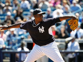New York Yankees starting pitcher Michael Pineda throws against the Baltimore Orioles at George M. Steinbrenner Field in Tampa, Fla., March 13, 2014. (KIM KLEMENT/USA Today)
