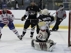 Kingston Voyageurs' Brandon O'Quinn (not shown) scores on Trenton goalie Denny Dubblestyne while Kingston's Michael Casale and Trenton's Shaquille Hickey look during the first period of an OJHL  North-East Conference semifinal playoff series at the Invista Centre on Thursday night. Kingston won 5-2. (Julia McKay/The Whig-Standard)