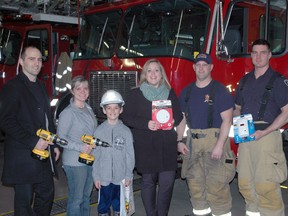 The St. Thomas & Elgin Home Builders' Association will be teaming up with the St. Thomas Fire Department to install smoke detectors in homes that need them. At the fire hall on Wellington St. Thursday were Cle Darsaut, left, of Hayhoe Homes; Stefanie Coleman-Dias of Coleman-Dias 3 Construction Inc. and her son Alex Dias; homebuilders' association president Lesley Hutton of Hayhoe Homes and firefighters Scott Gilchrist and Dave Knight. Ben Forrest/Times-Journal