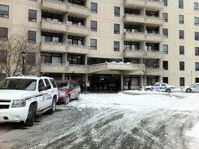 Police at the scene where a Russian diplomat was stabbed at a Stewart St. apartment building in Ottawa on Friday morning, March 14, 2014. (QMI Agency)