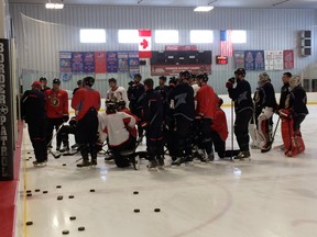 The Ottawa Senators focus on coach Paul MacLean during practice Friday, March 14, 2014 at the Sensplex in Kanata. (TONY CALDWELL Ottawa Sun)