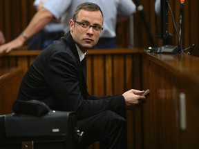 Oscar Pistorius sits in the dock during court proceedings in Pretoria on Friday, March 14, 2014. (Phill Magakoe/Reuters/Pool)
