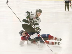 The Saints are hoping their first game back, against either Sherwood Park (pictured here) or Whitecourt goes a little smoother than the end result of this play where one of the Saints is taken out by a Park defenceman in league action. - Gord Montgomery, File Photo