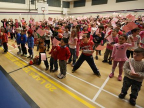 Students at St. Dominic School wore pink shirts and join together to stamp out bully in Edmonton, Alta., on Wednesday, Feb. 26, 2014. (Perry Mah/QMI Agency)