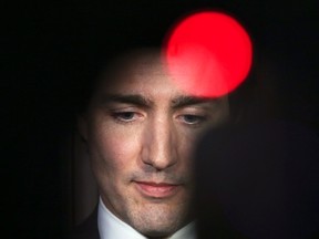 Liberal leader Justin Trudeau pauses while speaking to journalists on Parliament Hill in Ottawa February 25, 2014. (REUTERS/Chris Wattie)