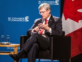 Canadian Prime Minister Stephen Harper (right) participates in a  question and answer session with the BC Chamber of Commerce in Vancouver, B.C. on Wednesday March 12, 2014. (Carmine Marinelli/QMI Agency)