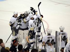 Pittsburgh Penguins goalie Marc-Andre Fleury celebrates with his team after blocking a shot during the shootout against the Anaheim Ducks at Honda Center. The Pittsburgh Penguins defeated the Anaheim Ducks in a shootout with a final score of 3-2. (Kelvin Kuo/USA TODAY Sports)