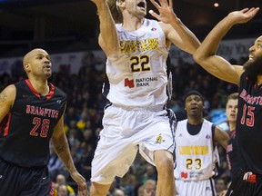 Zane Johnson of the London Lightning drives for two of his 20 points in the first half of Game 4 of the NBL quarterfinal against the Brampton A?s on Thursday night at Budweiser Gardens. (MIKE HENSEN, The London Free Press )