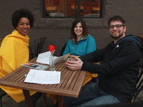 Seble Amelga, left, Tanya Newman, middle, and Stephen Newman enjoy some hot wine at Cafe Tiramisu, 10750 124 St. on Friday, Over 50 restaurants and cafes will knock off the dust and open their patios as part of the WinterCity Patio Party. (Trevor Robb/Edmonton Sun)