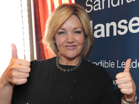 Then Associate Minister of Family and Community Safety Sandra Jansen gives a big thumbs up in northwest Calgary, Alta. on April 17,2012. STUART DRYDEN/CALGARY SUN