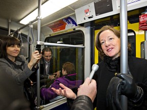 Premier Alison Redford, on an Edmonton LRT train in 2012, does not have any special police protection while in Edmonton. (File photo/Edmonton Sun}