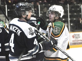 Terriers forward Taylor Sanheim and Steinbach defenceman Matt Franczyk exchange words during the Terriers' 2-0 win in Game 4 of the Addison Divison semifinal series against the Steinbach Pistons Mar. 14. (Kevin Hirschfield/THE GRAPHIC/QMI AGENCY)