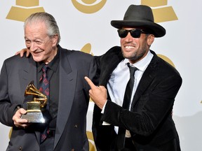Musicians Charlie Musselwhite (L) and Ben Harper, winners of the Best Blues Album award for 'Get Up!,' pose in the press room during the 56th GRAMMY Awards at Staples Center on January 26, 2014 in Los Angeles, California. The two were among the lineup announced to play Folk Fest this summer.   Frazer Harrison/Getty Images/AFP