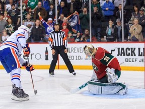 Taylor Hall scores the winner in the shootout against  Wild goalie Darcy Kuemper at Xcel Energy Center in St. Paul, Minn., on March 11, 2014,The Oilers won 4-3. Mandatory Credit: Brad Rempel-USA TODAY Sports