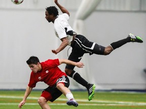 Ottawa Fury FC Adrian LeRoy wins an air battle for the ball against a York University player during an exhibition match at the Complexe Branchaud Briere in Gatineau on Saturday March 15,2014. The Fury won 2-1.
Errol McGihon/Ottawa Sun/QMI Agency