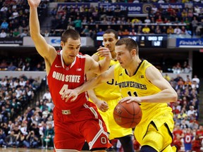 Michigan Wolverines guard Nik Stauskas drives to the basket against Ohio State Buckeyes guard Aaron Craft (4) in the semifinals of the Big Ten college basketball tournament at Bankers Life Fieldhouse in Indianapolis on March 15. (Brian Spurlock, USA Today Sports)