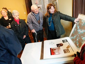 Members of the Architectural Conservancy of Ontario, Quinte Region Branch check out original wallpaper samples in the Breakfast Room at Glanmore National Historic Site in Belleville, Ont. during a restoration review tour Sunday, March 16, 2014. - Jerome Lessard/The Intelligencer