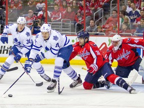 Toronto Maple Leafs right winger David Clarkson (71) takes a shot against Washington Capitals defenceman Jack Hillen (38) and goalie Jaroslav Halak (41) during the second period at Verizon Center on March 16. (Paul Frederiksen-USA TODAY Sports)