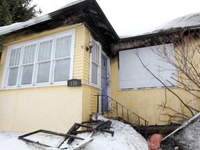 Fire damage is seen on a house at 156 Evanson Street in Winnipeg, Man. Sunday March 16, 2014 following an overnight blaze that caused approximately $180,000 in damage. (BRIAN DONOGH/Winnipeg Sun)
