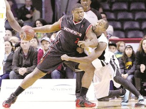 Elvin Mims of the London Lightning defends against Windsor Express centre DeAndre Thomas, a former Lightning teammate, at Budweiser Gardens this season. (File photo)