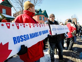 Members of the Ottawa Ukrainian community and their supporters are shown outside the Russian Embassy, They gathered to protest recent actions by the Russians in Crimea and other parts of Ukraine. A majority of Crimea Ukranians voted in a referendum Sunday, March 16, 2014 to join Russia.
Errol McGihon/Ottawa Sun/QMI Agency