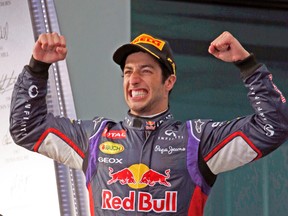 Red Bull Formula 1 driver Daniel Ricciardo celebrates after finishing second in the Australian Grand Prix, only to be disqualified later on for “fuel-flow irregularities.” (REUTERS)