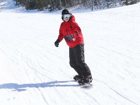 Gino Donato/The Sudbury Star
Will Lawton snowboards at Adanac Ski Hill on Sunday afternoon. Thanks to colder temperatures and extra snow accumulation, the city has granted an extended season to municipal ski hills. All three ski hills will resume regular operational hours after March Break, until further notice. The schedule is: Adanac Ski Hill: March 17-18, closed; March 19-21, 10 a.m. to 4 p.m. and 6 to 9:30 p.m.; March 22-23, 9 a.m. to 4 p.m. Capreol Ski Hill: March 17, closed; March 18, 6 to 9:30 p.m.; March 19, closed; March 20, 6 to 9:30 p.m.; March 21, closed; March 22-23, 12 to 4:30 p.m. Lively Ski Hill: March 17-18, closed; March 19, 6 to 9:30 p.m.; March 20, closed; March 21, 6 to 9:30 p.m.; March 22, 12 to 4:30 p.m.; March 23, 12 to 4:30 p.m.