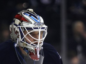Winnipeg Jets goaltender Michael Hutchinson takes part in pre-game warmup before the team took on the Dallas Stars in NHL action at MTS Centre in Winnipeg, Man., on Sun., March 16, 2014. Kevin King/Winnipeg Sun/QMI Agency