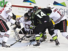 Edmonton's Riley Kieser can't get past Red Deer's Patrik Bartosak during the second period of the Edmonton Oil Kings' WHL hockey game against the Red Deer Rebels at Rexall Place in Edmonton, Alta., on Sunday, March 16, 2014. (Codie McLachlan/Edmonton Sun)