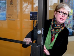 Donna Kennedy-Glans, MLA for Calgary Varsity and an associate minister in Alberta Premier Alison Redford's cabinet, enters her  Constituency Office after she talked to the media  where she says she is resigning her post and leaving the Tory caucus. Kennedy-Glans was outside her office in NW Calgary, Alta. on Monday March 17, 2014. Stuart Dryden/Calgary Sun