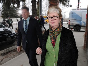 Donna Kennedy-Glans, MLA for Calgary Varsity and an associate minister in Alberta Premier Alison Redford's cabinet, enters her Constituency Office after she talked to the media  where she says she is resigning her post and leaving the Tory caucus. Kennedy-Glans was outside her office in NW Calgary, Alta. on Monday March 17, 2014. Stuart Dryden/QMI Agency