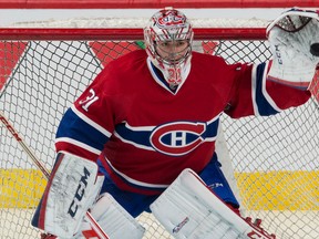 Carey Price catches a puck March 15 during a game against the Ottawa Senators. (BEN PELOSSE/LE JOURNAL DE MONTRÉAL/QMI AGENCY)