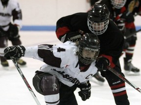 Jeff Tribe/Tillsonburg News
Tillsonburg Oxford Source For Sports Bantam captain Alex Sutherland cuts toward the puck under defensive attention Sunday afternoon inside the Kinsmen/Memorial Arena.