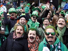 Spectators attend St Patrick's Day parade in Dublin on March 17, 2014. (AFP PHOTO/ PETER MUHLY)