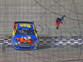 Carl Edwards celebrates with a backflip after winning the NASCAR Sprint Cup Series Food City 500 on Sunday. (AFP)