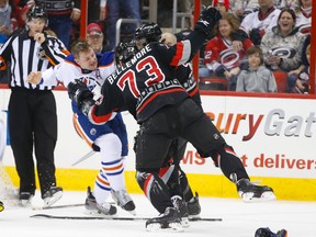 Matt Hendricks made an impact against the Hurricanes sunday, drawing the ire of Brett Bellemore and Ron Hainsey. (USA TODAY)