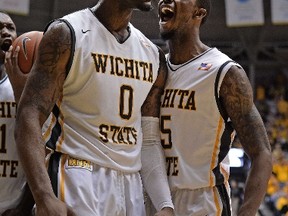 Wichita State players Chadrack Lufile (left) and Nick Wiggins, the brother of the more celebrated Andrew Wiggins, will be looking to get the top-seeded Shockers through the ultra-competitive Midwest Region. (Peter Aiken/AFP)