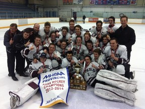 St. Paul’s Crusaders players and coaches celebrate their Manitoba high school hockey championship victory, Monday, March 17, 2014, at St. James Civic Centre in Winnipeg. KIRK PENTON/Winnipeg Sun/QMI Agency