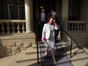 Premier Alison Redford leaves Government House after a caucus meeting in Edmonton on Monday, March 17, 2014. (PERRY MAH/Edmonton Sun)