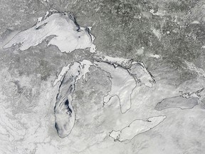Ice cover on the Great Lakes is seen in an image acquired by the Moderate Resolution Imaging Spectroradiometer (MODIS) on NASA's Aqua satellite at 11:20 EST (16:20 GMT) February 16, 2014. Ice cover on North America's Great Lakes reached 88 percent in mid-February 2014 levels not observed since 1994, according to a NASA news release.  REUTERS/NASA/Handout