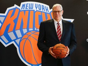 Phil Jackson poses during a news conference announcing him as the team president of the New York Knicks basketball team at Madison Square Gardens in New York March 18, 2014.  (REUTERS/Shannon Stapleton)