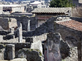 The House of Neptune in the Modesto way, where a custodian doing rounds last week discovered that "a part of a fresco in the House of Neptune had been removed" is pictured on March 18, 2014. (AFP PHOTO/CARLO HERMANN)