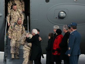 The last Canadian soldiers to leave Afghanistan arrived home today to tears, hugs from family and friends in Ottawa On. Tuesday March 18,  2014. Troops filed off the plane to a receiving line that included Harper, Gov. Gen. David Johnston and Gen. Tom Lawson, the chief of the defence staff.  Tony Caldwell/QMI Agency