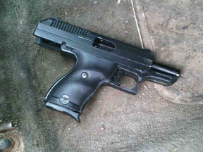 Police supplied photo of 9mm handgun seized after a routine stop over a hanging muffler.