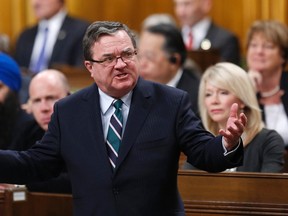 Canada's Finance Minister Jim Flaherty speaks during Question Period in the House of Commons on Parliament Hill in Ottawa February 13, 2014. REUTERS/Chris Wattie