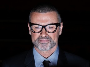 British singer George Michael poses for photographers before a news conference at the Royal Opera House in central London, in this file picture taken May 11, 2011. (REUTERS/Stefan Wermuth/Files)