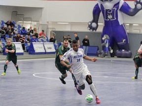 Colombian standout Jonatton Cordoba fights off a Lakeland Rustlers challenge on his way to a 7-2 victory for the Keyano Huskies in ACAC futsal finals. Cordoba was named ACAC futsal player of the year and teammate Rodrigo Koebsch was tournament MVP. The women’s championship was won by the Medicine Hat Rattlers. (Keyano College)